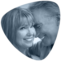 Mature couple smiling. Senova Dental Studios is a dentist offering dental implants Watford, Hertfordshire.