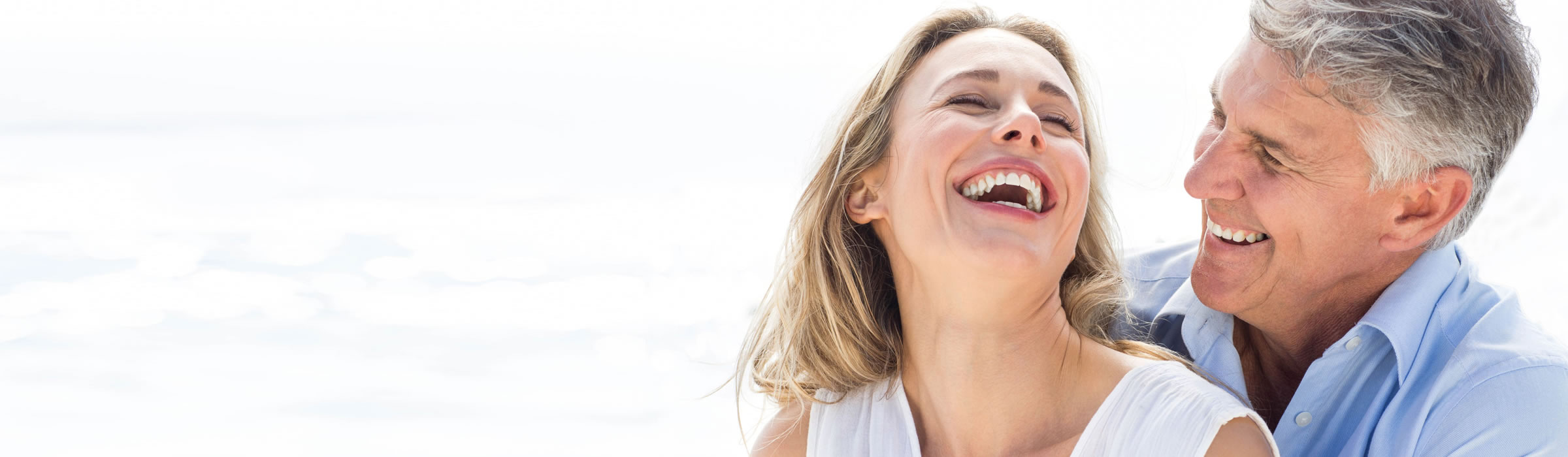 Mature couple laughing together. Cosmetic dentist Watford, Senova Dental Studios in Watford, Hertfordshire