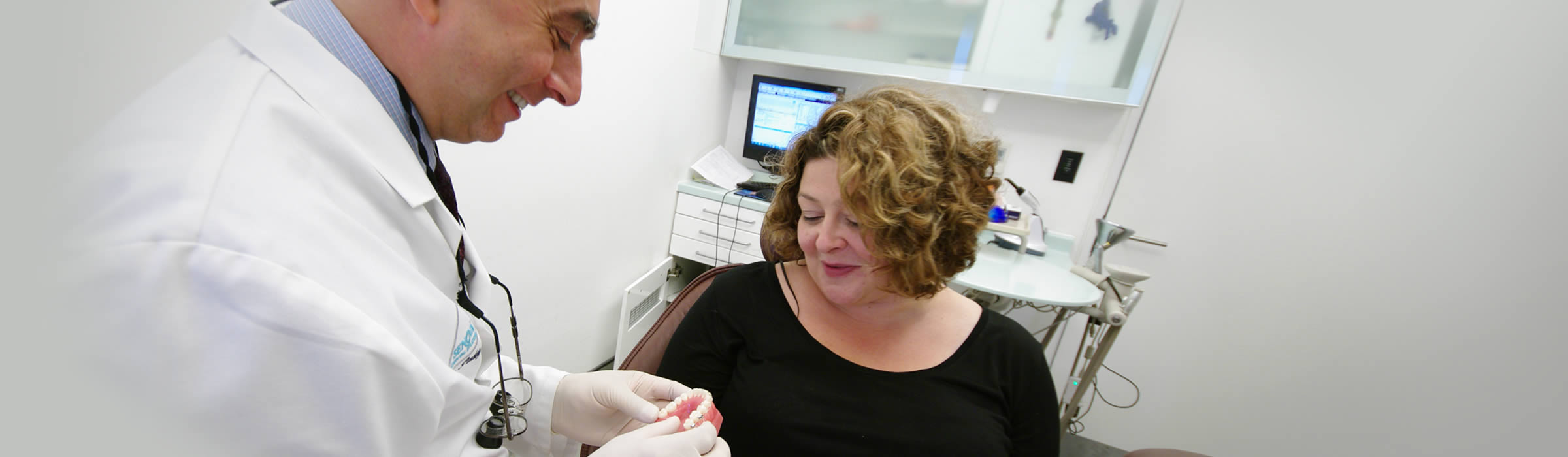 Patient receiving dental advice at our Watford dentist, Senova Dental Studios in Watford, Hertfordshire