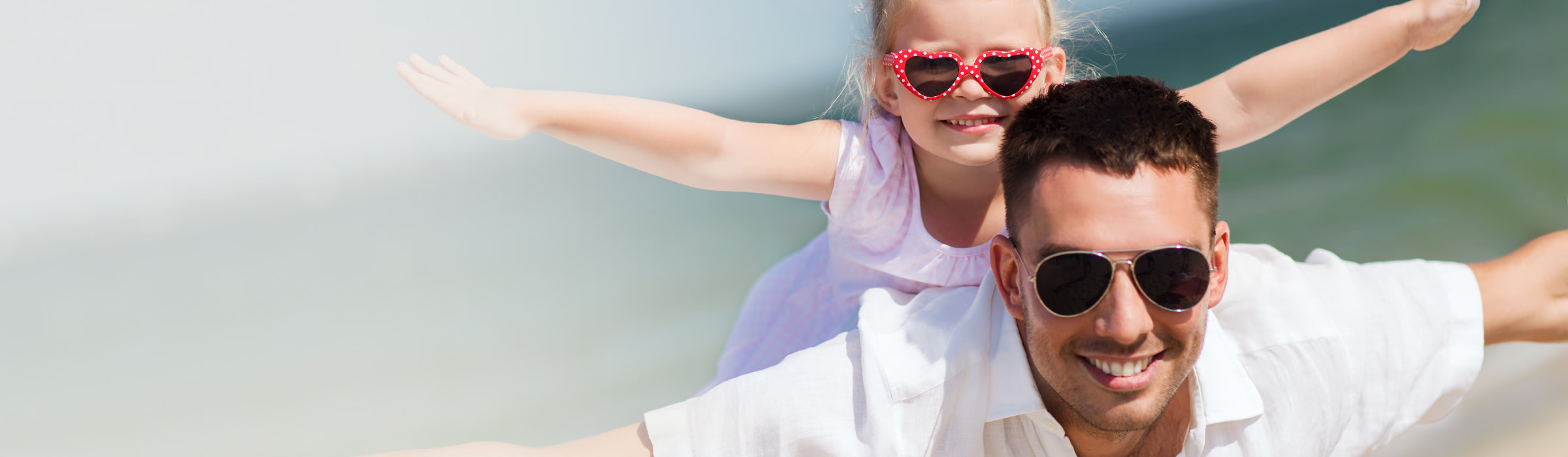 Father and daughter posing together. Visit our Watford dentist, Senova Dental Studios in Watford, Hertfordshire